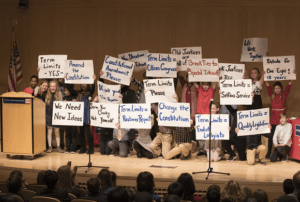 Students holding protest signs