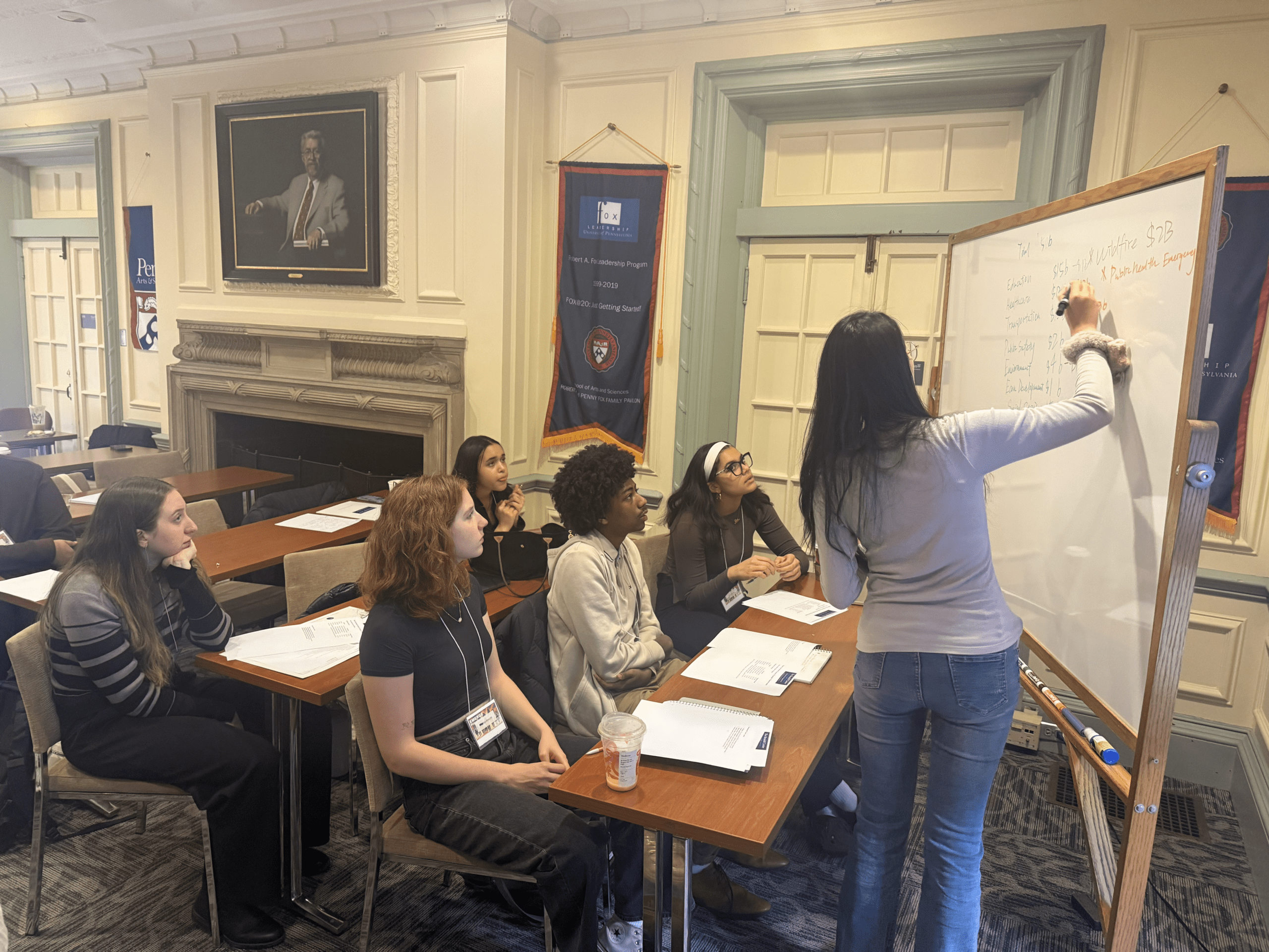 Group of students in front of their presentation