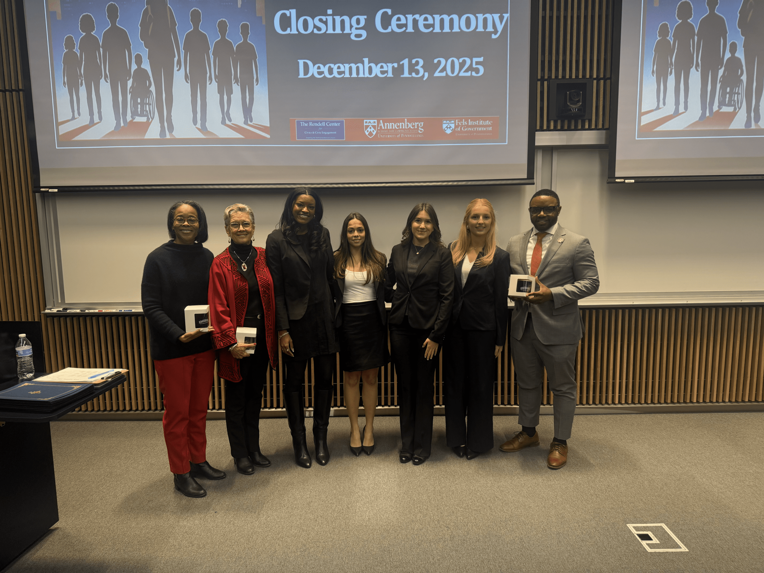 Group of students in front of their presentation